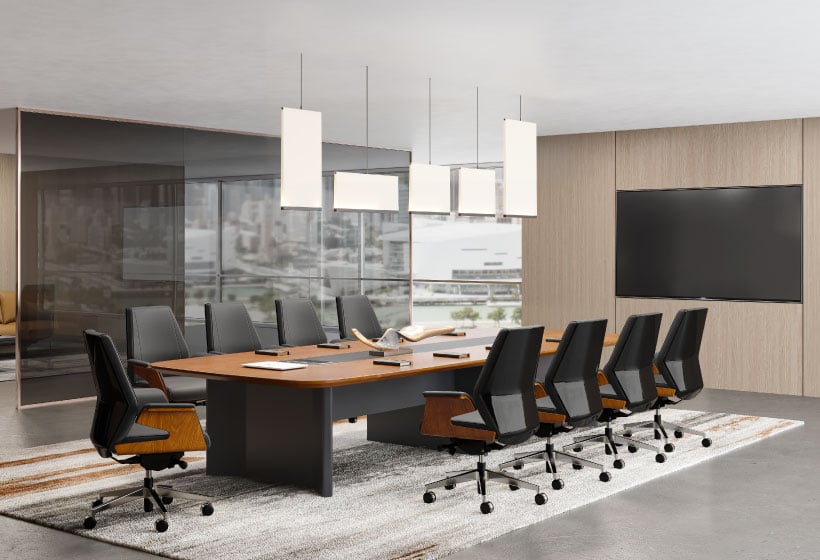 A spacious conference room featuring a large table surrounded by several chairs, suitable for meetings and discussions.